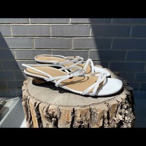 Stuart Weitzman white leather sandals.